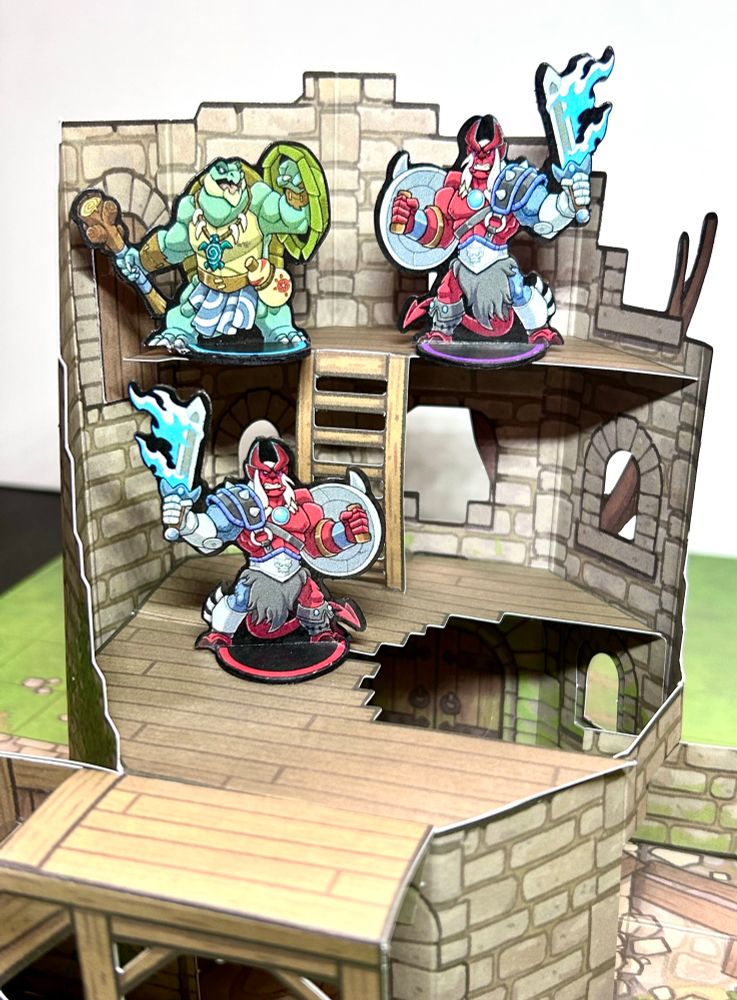 Paper minis battling in a tower