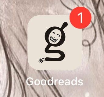 Goodreads logo (a lowercase 'g' with the upper round part tilted rather severely to the left), badly doodled-on to add a creepy sharp-toothed smile and unfocused eyes. The tail of the g is now a bent arm with a small clawed hand at the end of it.