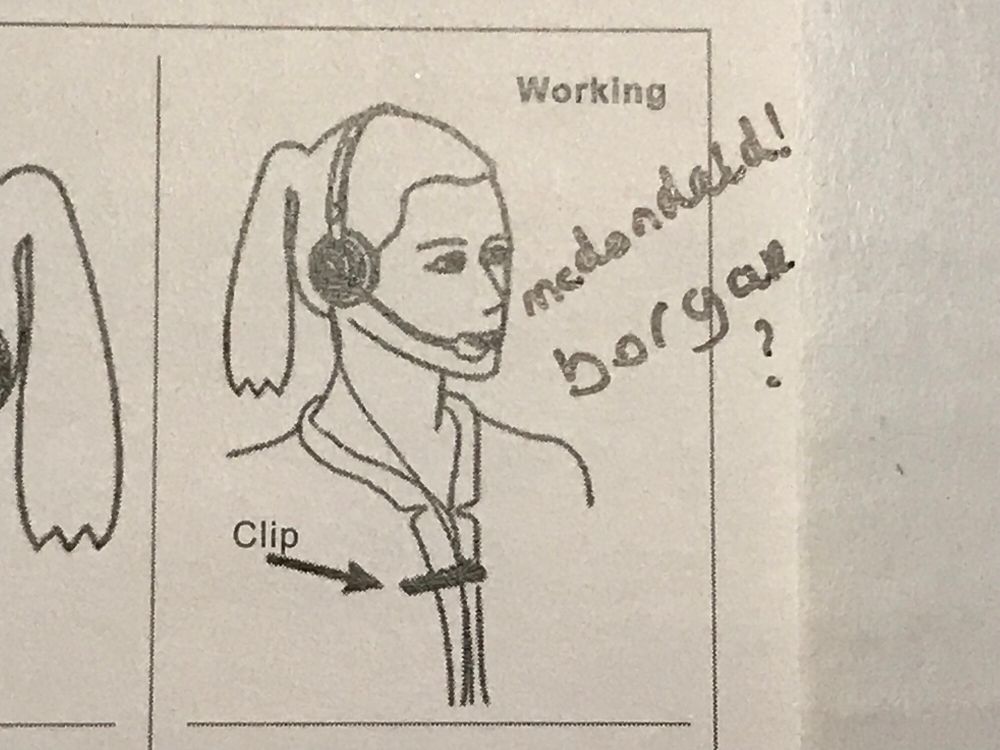 illustration from product manual, depicting a woman with hair tied back wearing a telephone headset, and demonstrating usage of the cable clip
it is defaced and reads: mcdondald! borgar?