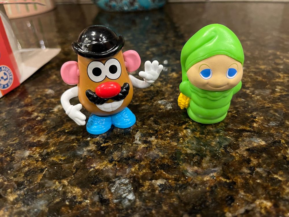 The two opened toys… Mr Potato Head and Gloworm.