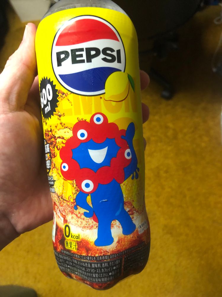 A Japanese Lemon Pepsi with the nightmare inducing mascot from Japanese technology show 