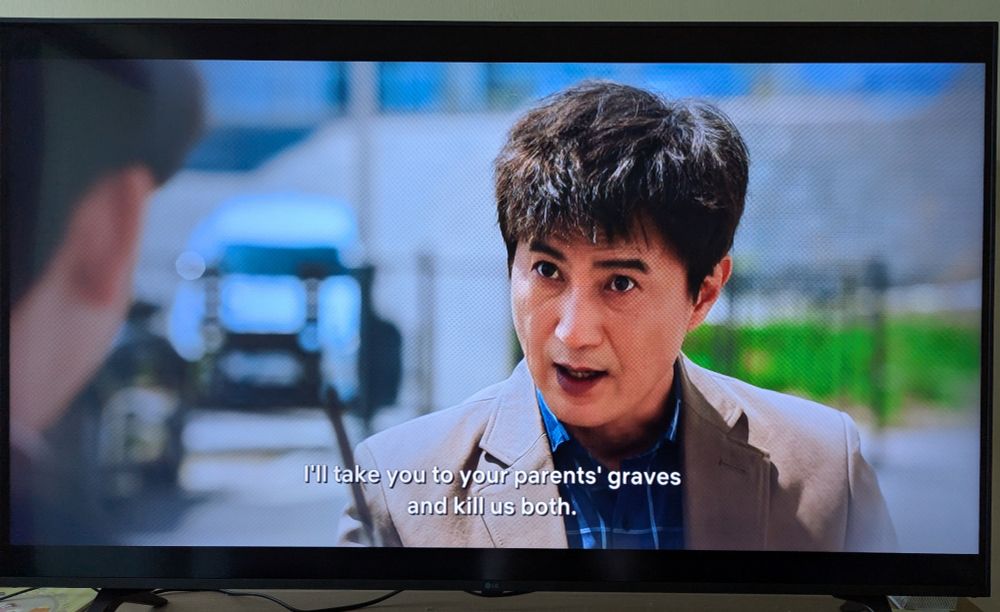 Still image from "The Devil Judge" of Professor Min saying "... I'll take you to your parents' graves and kill us both."