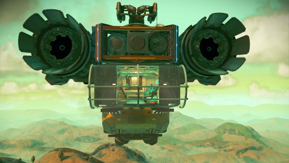 A ridiculous top-heavy space rv, hanging beneath oversized engine nacelles. Rear view looking into the living space while airborne.