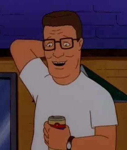 Hank Hill from King of the Hill appearing to be bashful while holding a beer. He’s wearing a white t-shirt and square eyeglasses. He has one hand up behind his head.