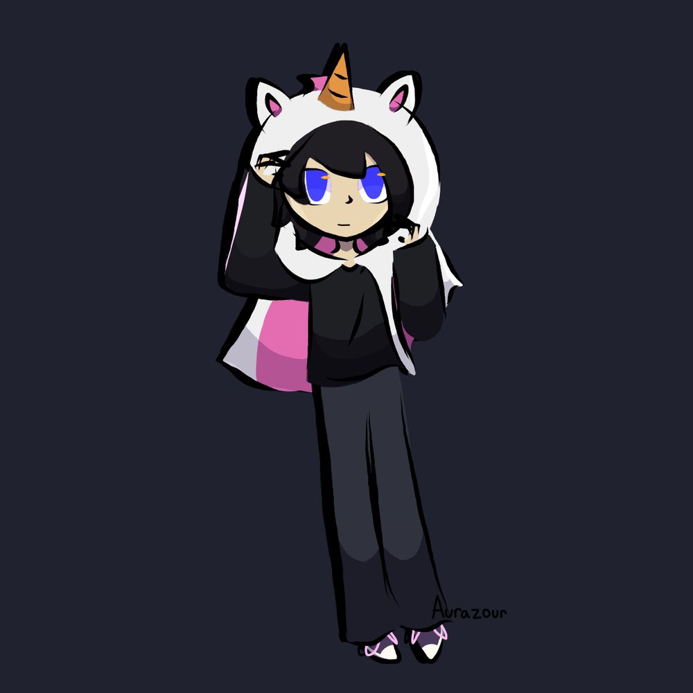 Ian (oc) in a halloween unicorn cloak. The cloak is white with a pink underlining. It has a unicorn horn (gold) and a mane (pink) going down the back. The hood of the cloak has ears attached to it. He is wearing a simple black long sleeve shirt and gray pants, along with his usual purple and pink shoes.