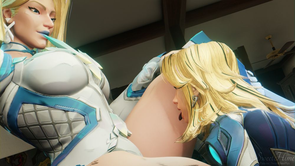 Sue licking Emma's thighs.