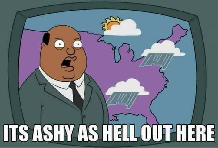 A Black cartoon weather man standing in front of a weather screen with heavy ash falling from clouds on the east coast and the caption reads, It’s ashy as hell out here. 