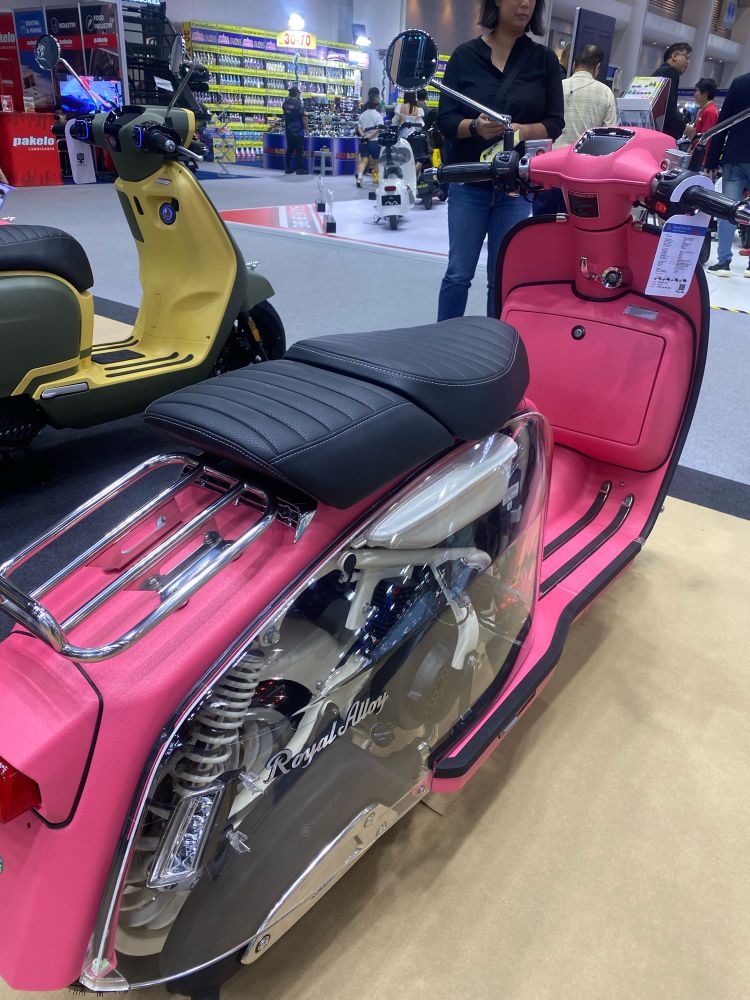 Pink scooter in Lambretta style by Royal Alloy, featuring a translucent motor cover that reveals the engine.
