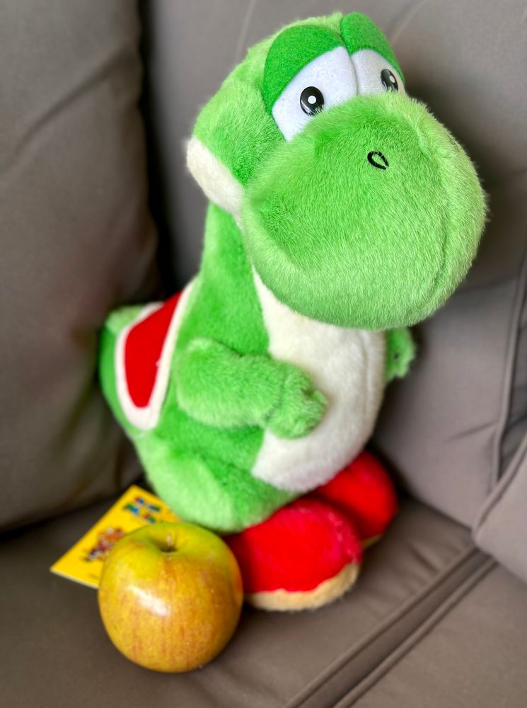 Tagged medium Sun Arrow Yoshi plush with an apple.