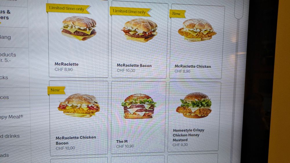 Photo of McDonald's menu with variations of a McRaclette burger