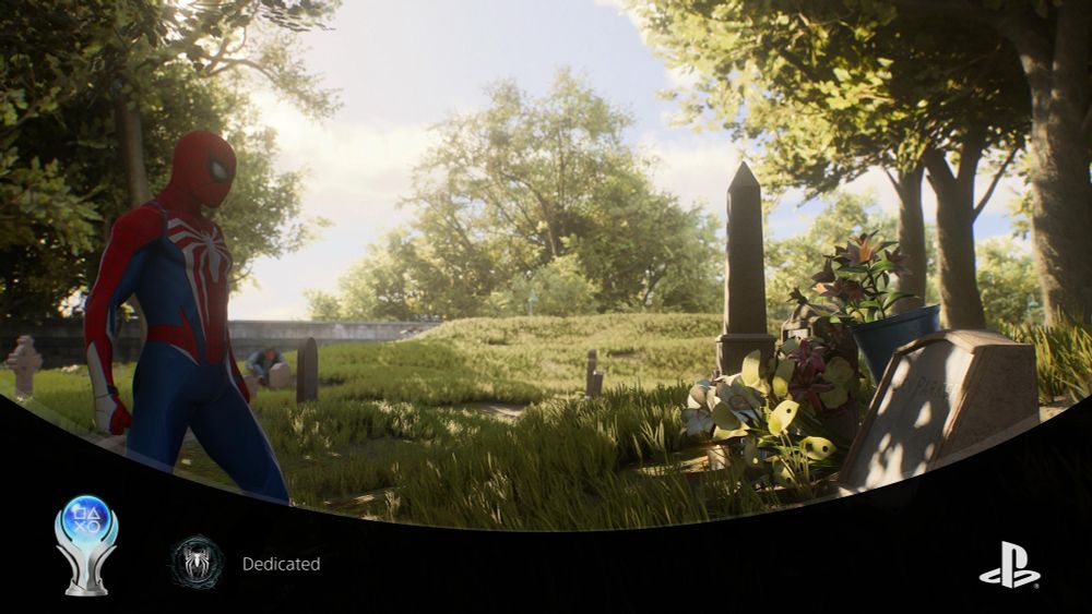 spider man looking at uncle Ben’s grave, there’s a PlayStation overlay for getting the platinum trophy