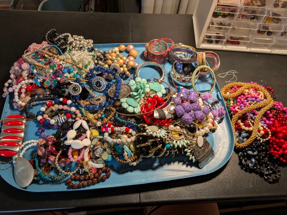 Tray of costume jewelry being sorted