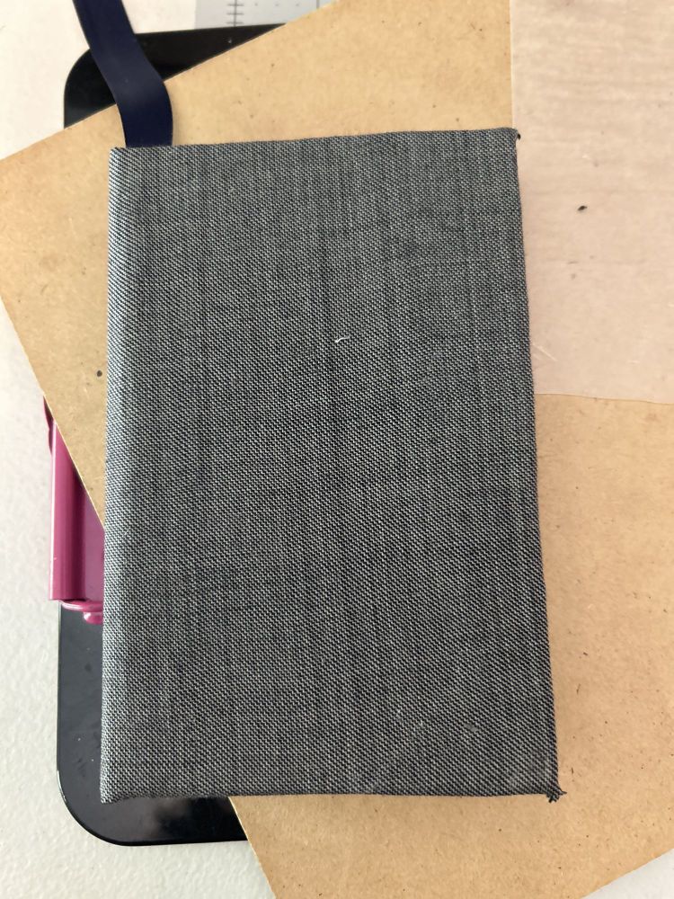 A hand bound book, cloth cover