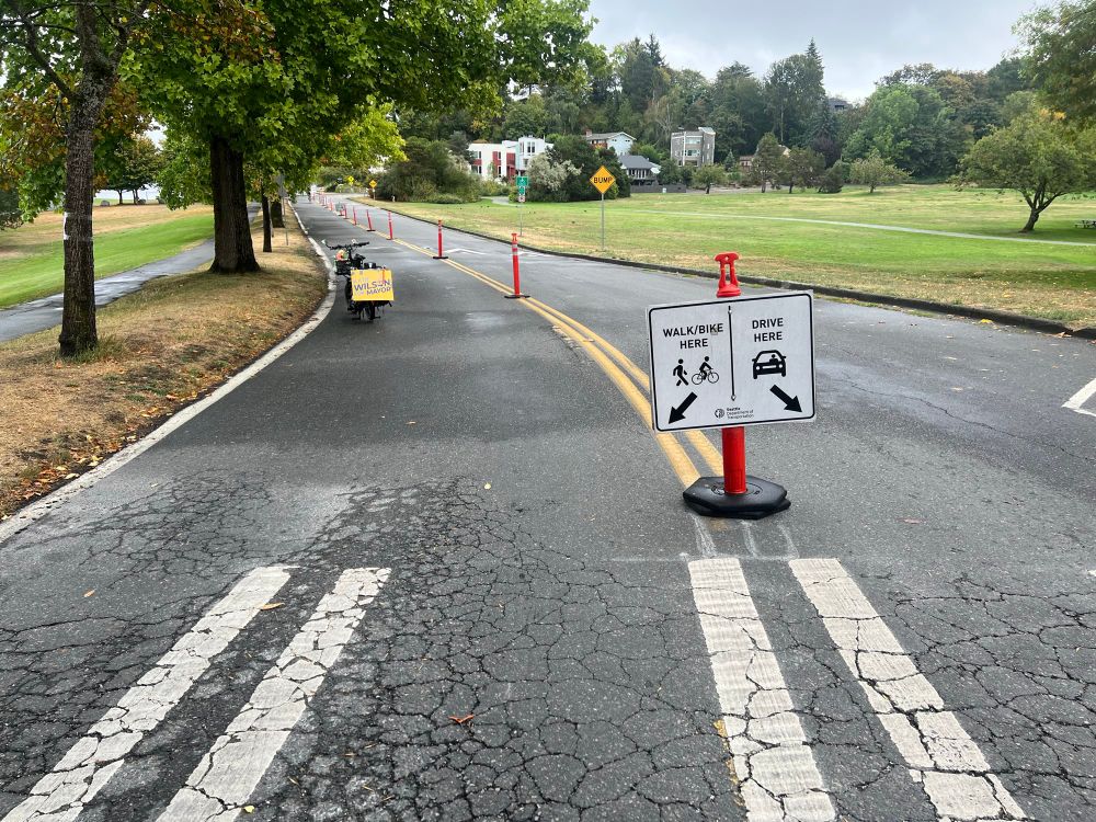 Similar picture only now the orange cones are on the center double yellow stripe matching the cones further along. 