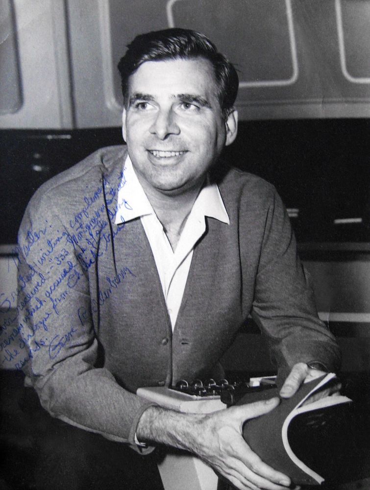 Gene Roddenberry holding a script while sitting in the Enterprise captain’s chair in 1967.
