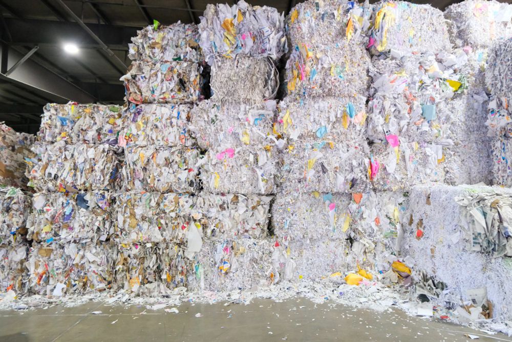 Large blocks of paper scraps are stacked on top of each other in the Inland Empire Paper facility. 