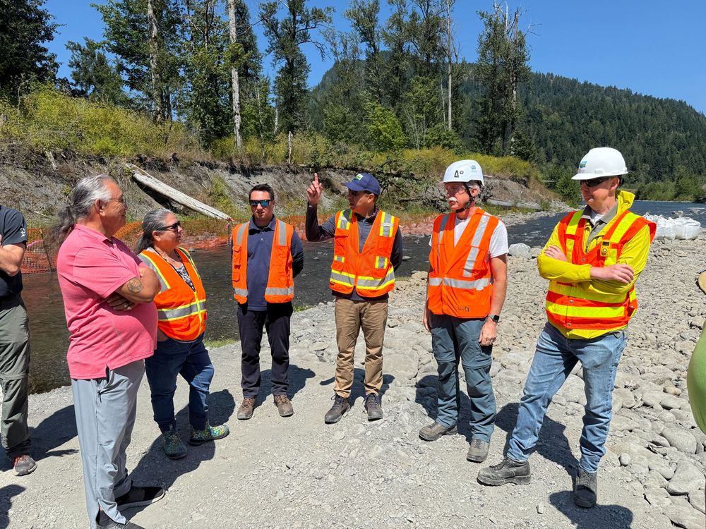 Members of Ecology and the Lower Elwha Klallam Tribe meet at the Indian Creek spill location to discuss cleanup operations.