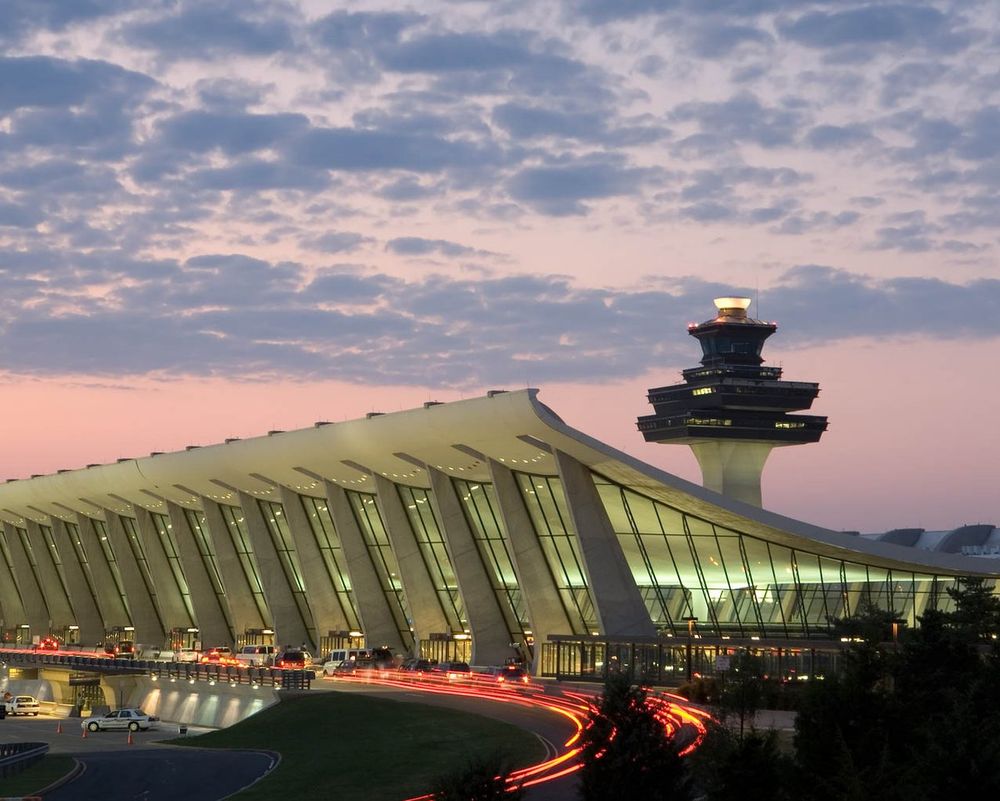 A photo of the Main Terminal at Washington Dulles International Airport during dusk in Virginia, USA.