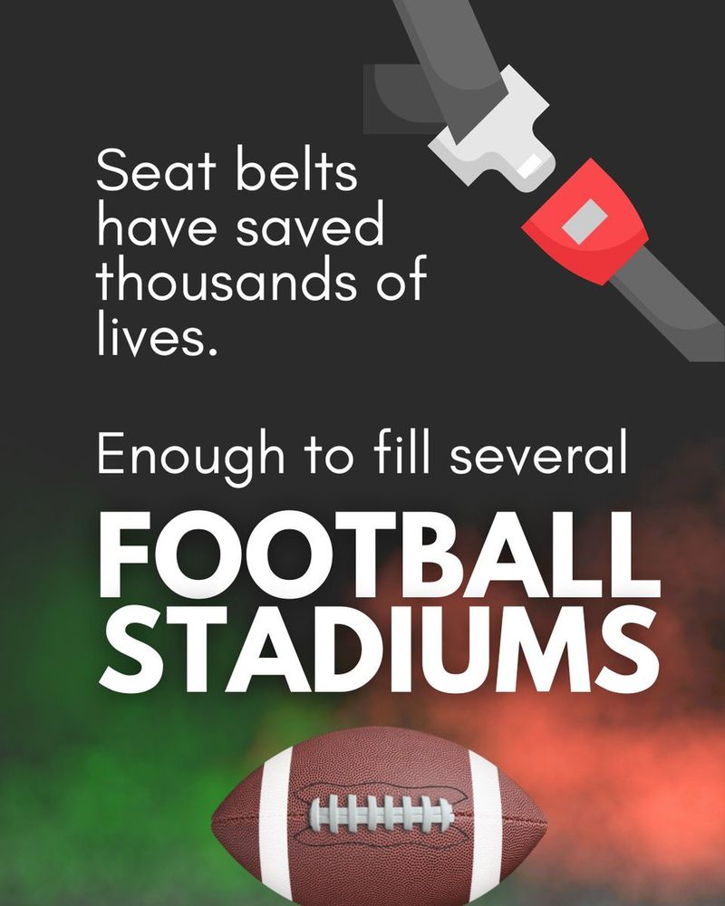 Promotional graphic emphasizing the importance of seat belts, stating "Seat belts have saved thousands of lives. Enough to fill several football stadiums." Includes an image of a seat belt and a football.