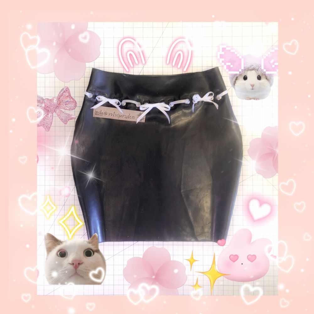 Black bodycon latex skirt with Viper's Den logo decal, ribbon details, and bow details