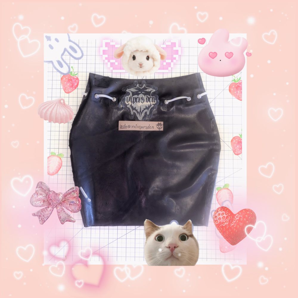 Black bodycon latex skirt with Viper's Den logo decal, ribbon details, and bow details