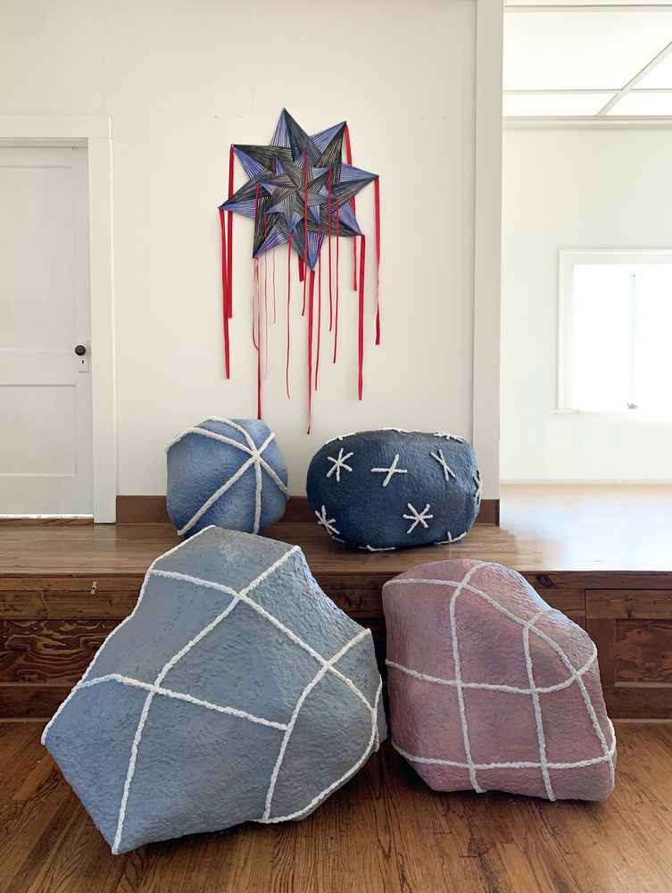 Star Kite, Night Kite and Four Stones, 2024, Kite: 68 x 33 inches, Acrylic on sewn canvas with ribbons. Stones: various sizes, largest 39 x 38 x 24 inches, Acrylic on sculptamold
