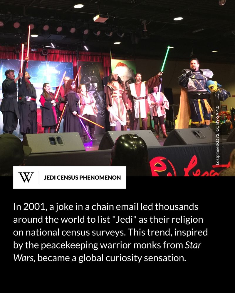 Group of people in Star Wars costumes on a convention stage, holding lightsabers. Some are dressed as Jedi, others as Sith, with sci-fi artwork in the background. Text says: In 2001, a joke in a chain email led thousands around the world to list "Jedi" as their religion on national census surveys. This trend, inspired by the peacekeeping warrior monks from Star Wars, became a global curiosity sensation.