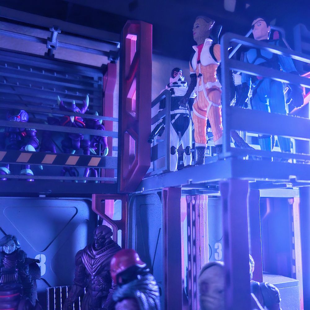Bounty hunters, pirates, and mercenaries stand at the ready, weapons charged. Tension is high