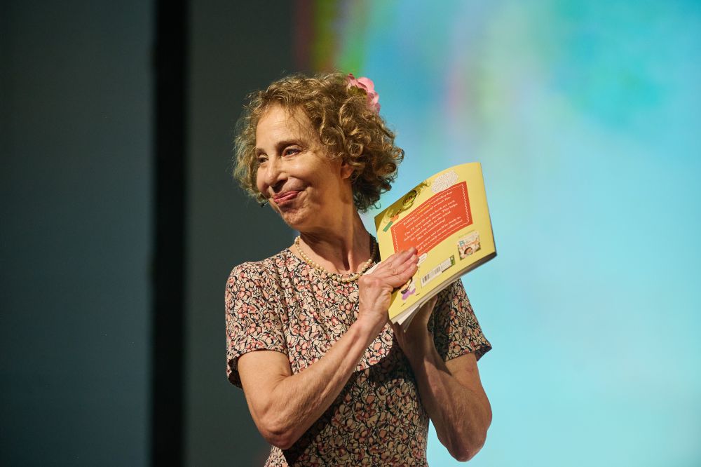Colette Hiller holding her winning book.
