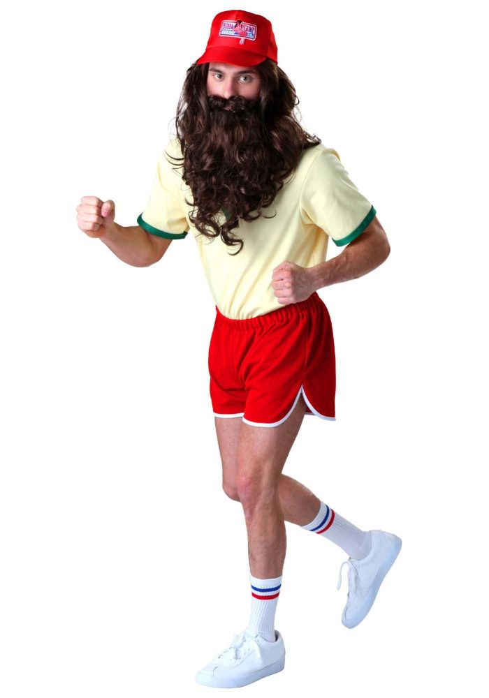 Man wearing a Bubba Gump Shrimp Co. red har with long dark brown hair and a very long beard in 70s running gear, including a light yellow shirt with green trim and short red running shorts with white trim. He is also wearing white running shoes and white socks with blue and red bands at the top.