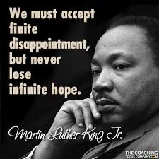 An image of Martin Luther King Jr with his quote- “We must accept finite disappointment, but never lose infinite hope.”