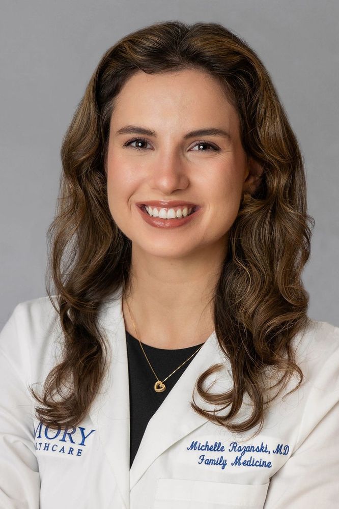 headshot of Dr. Shelby Rozanski wearing her Emory Healthcare white coat