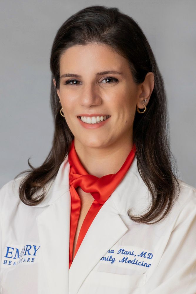 headshot of Dr. Mira Itani wearing her Emory Healthcare white coat