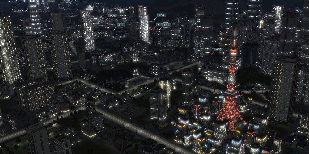 Image provenant de A-Train 9 (PC) Ville de nuit illuminé avec pleins d'immeubles, de gratte-ciels, de route ainsi que la Tour de Tokyo en vue 3D ressemblant un peu à Cities Skyline