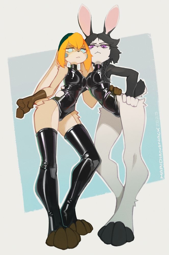 Derby (left) and Sol (right) looking down at the viewer wearing latex leotards