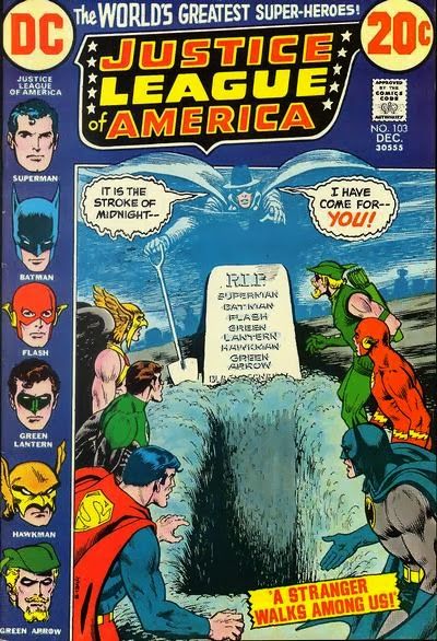 The cover of Justice League of America issue 103, showing an open grave surrounded by members of the league and a ghostly Phantom Stranger announcing that it is the stroke of midnight and he has come for...