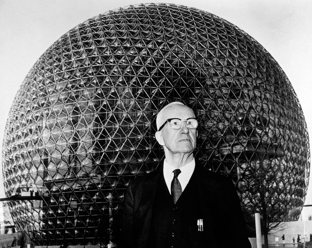 buckminster fuller in front of a geodesic dome