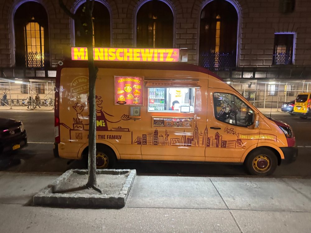 A photo of the Manischewitz-branded food truck parked on a NYC street.