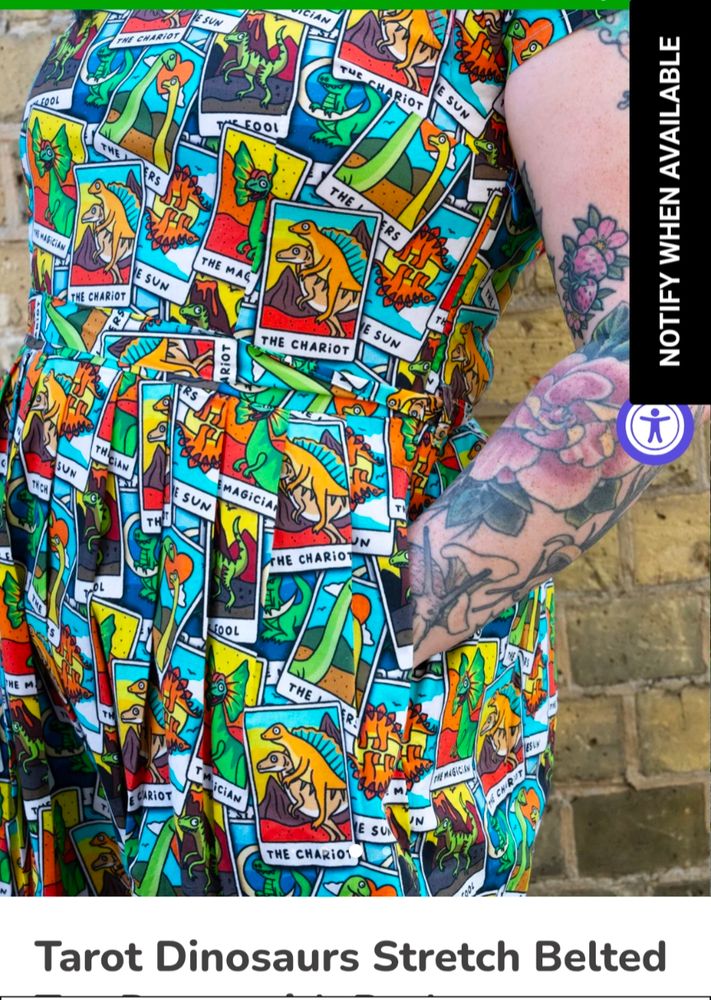Screenshot of a side of torso view of a dinosaur dress. The dinosaurs are brightly coloured and posed in tarot related tableau. It is a screenshot from the run and fly website 