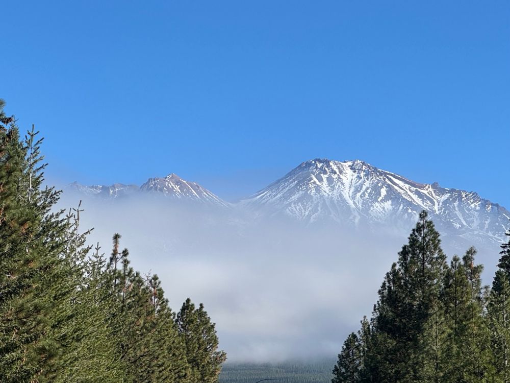 Snowy Mount Shasta almost obscured by clouds