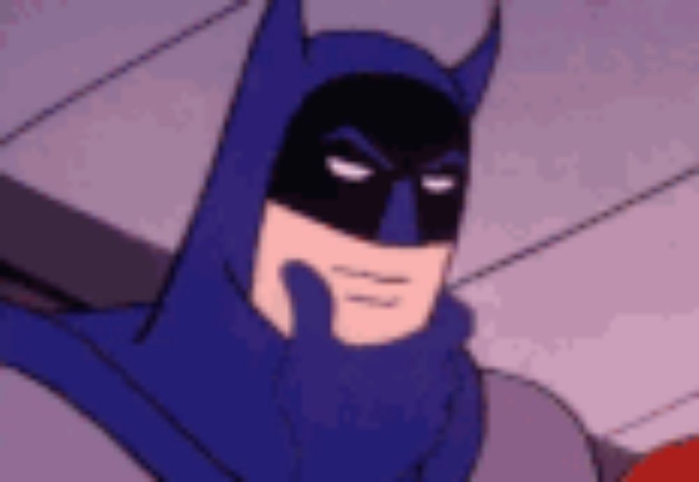 a close up of a cartoon character wearing a batman costume .