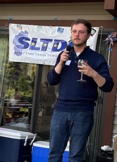 Jaron Brandon, candidate for California State Senate District 4, speaking into microphone at South Lake Tahoe Democratic Club General Meeting on June 7.