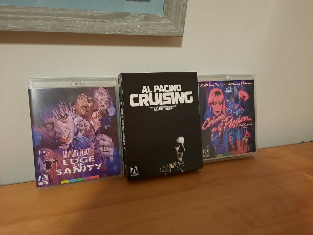 Three dvd cases lined up against a beige wall. The movies, from left to right, are Edge of Sanity, Cruising, and Crimes of Passion