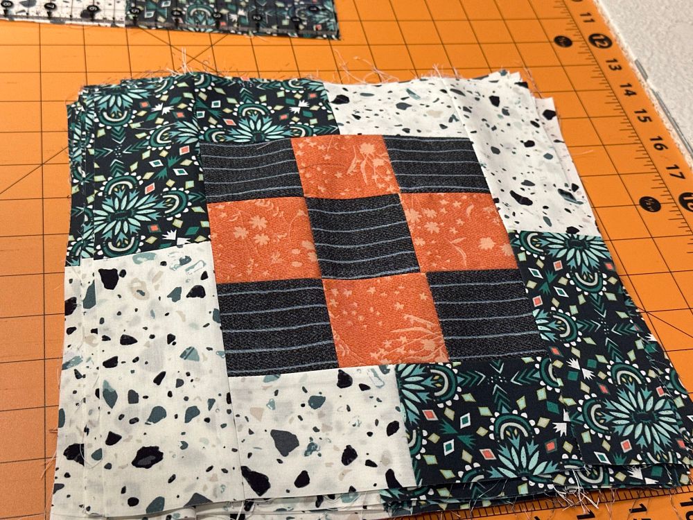 First few stages of the completed bento box. I tried to write a better description but I’m colorblind so I gave up trying to describe further. The middle is a checkerboard pattern and that is surrounded by two additional patterns, each on opposite corners of the checkerboard. 