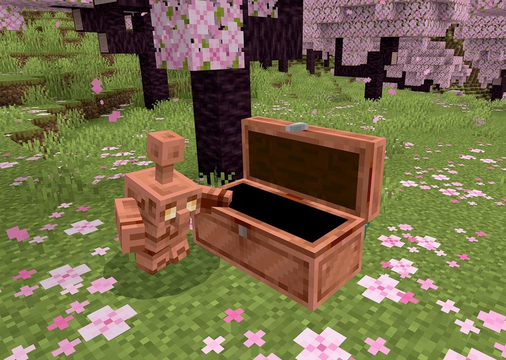 A screenshot of a copper golem standing next to an open copper chest inside a cherry blossom grove.