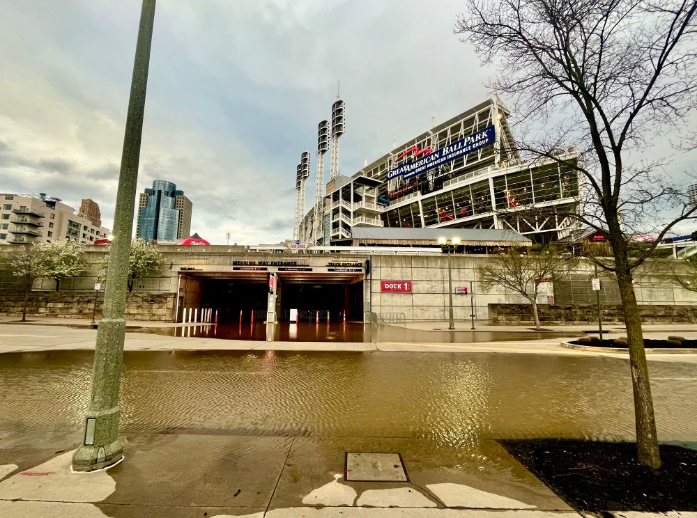 Photo of Great American Ballpark taken from Barry Larkin Way, showing the road flooded just beating the stadium gates.