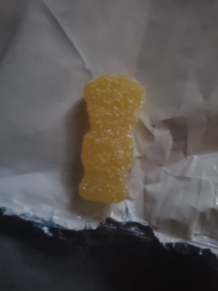 Picture of a yellow sour patch kid gummy