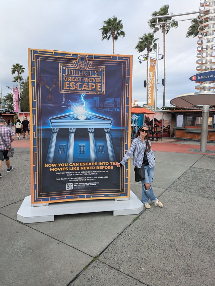 User in front of Back to the Future sign 