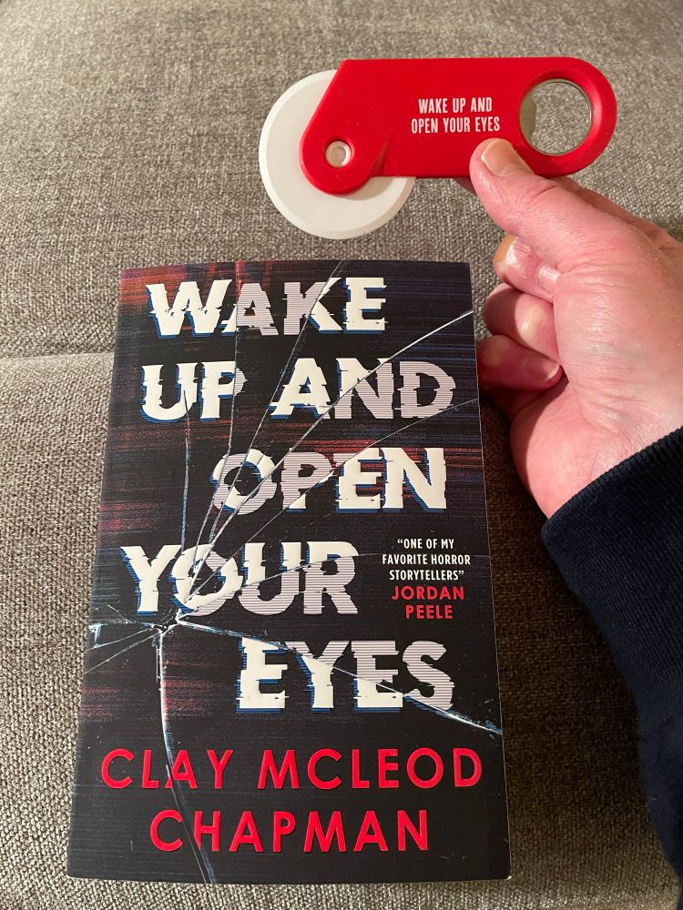 Clay McLeod Chapman’s new novel WAKE UP AND OPEN YOUR EYES, and a branded pizza cutter which isn’t at all sinister, no sir
