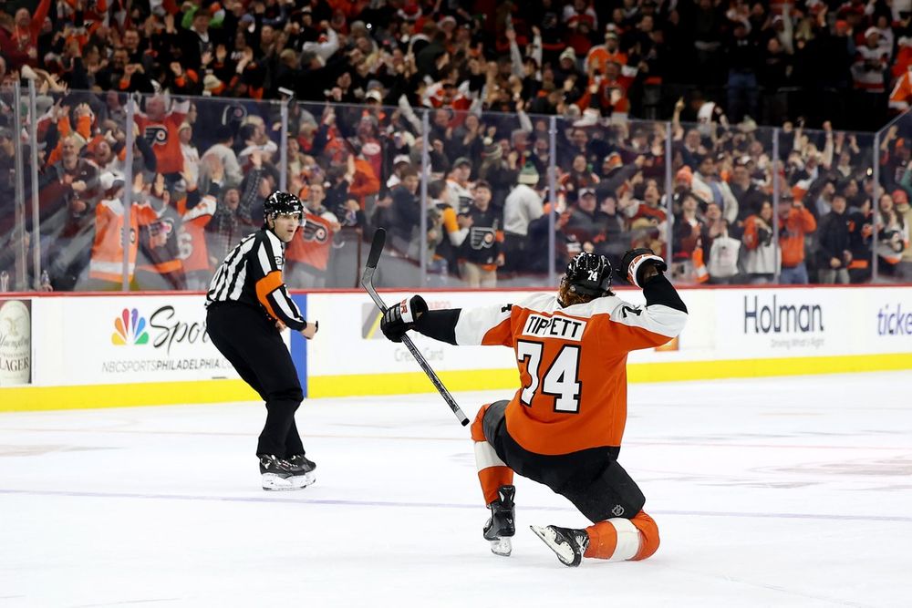 Owen Tippett celebrates his OT winner on ice in a Flyers uniform.
